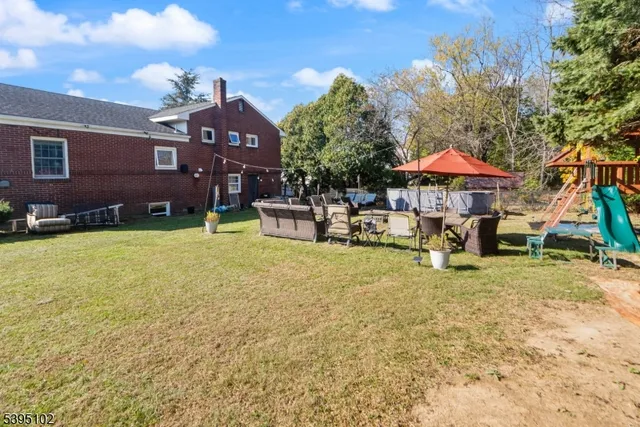a view of a house with backyard porch and sitting area