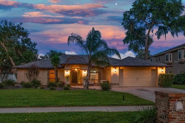 a view of house with outdoor space and garden