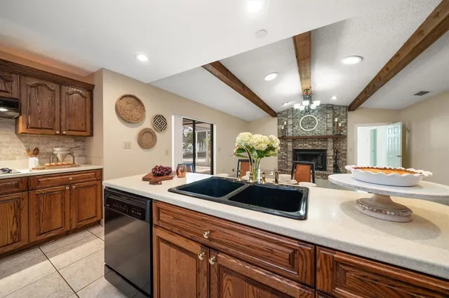 a kitchen with a sink and a refrigerator