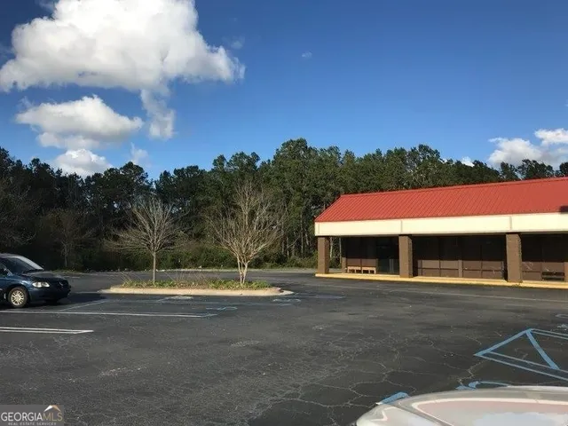a view of a parked cars in front of a building