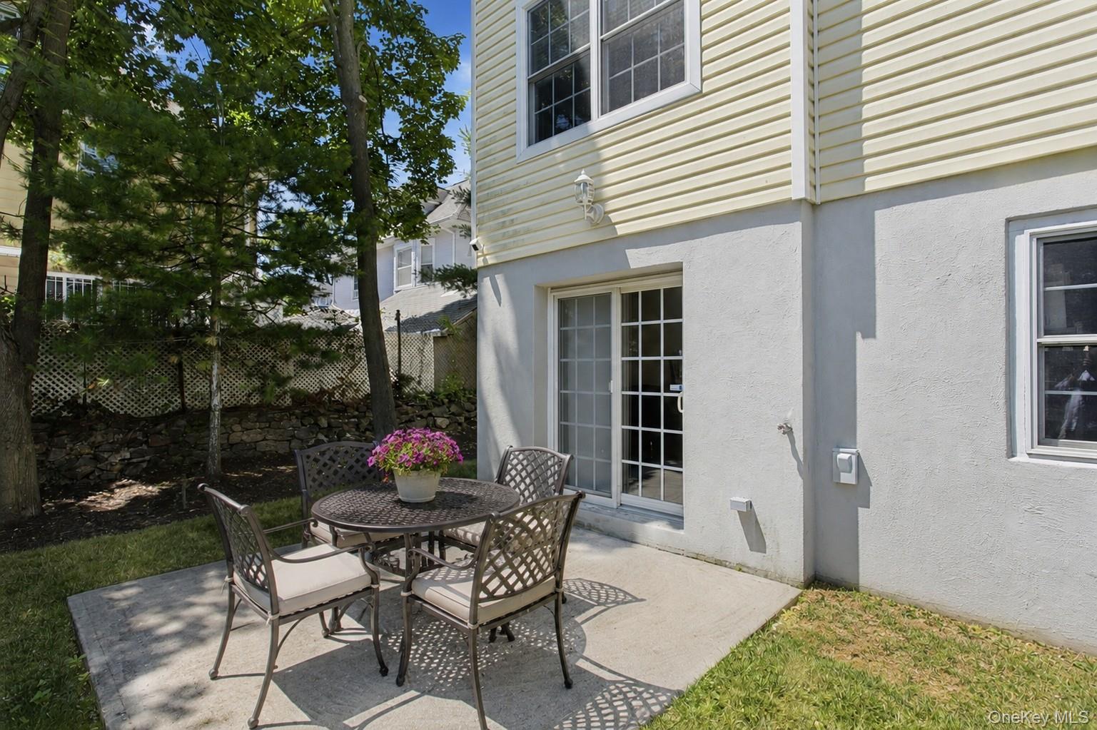 11 Prince Street, Unit C5 New Rochelle, NY 10801 - Photo 17 of 21 Patio with access to lower level. Virtually staged furniture.