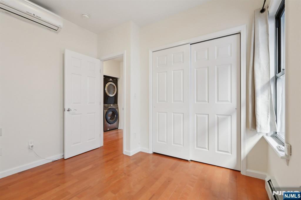 32 Hudson Terrace, Unit 2 Edgewater, NJ 07020 - Photo 21 of 42 a view of an empty room with window and bathroom