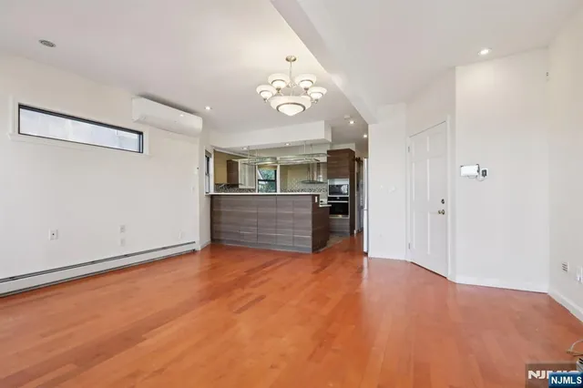 a view of a kitchen with a sink cabinets and a ceiling fan