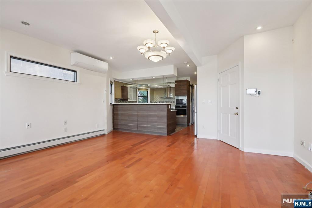 32 Hudson Terrace, Unit 2 Edgewater, NJ 07020 - Photo 7 of 42 a view of a kitchen with a sink cabinets and a ceiling fan