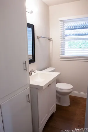 a bathroom with a sink and a toilet
