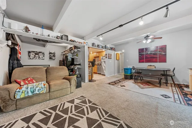 a room with furniture a flat screen tv and a large window