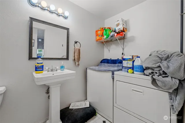 a utility room with dryer and washer