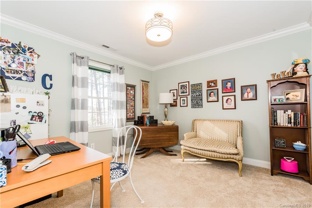 11161 Watertrace Drive Tega Cay, SC 29708 - Photo 15 of 24 a room with furniture and a window