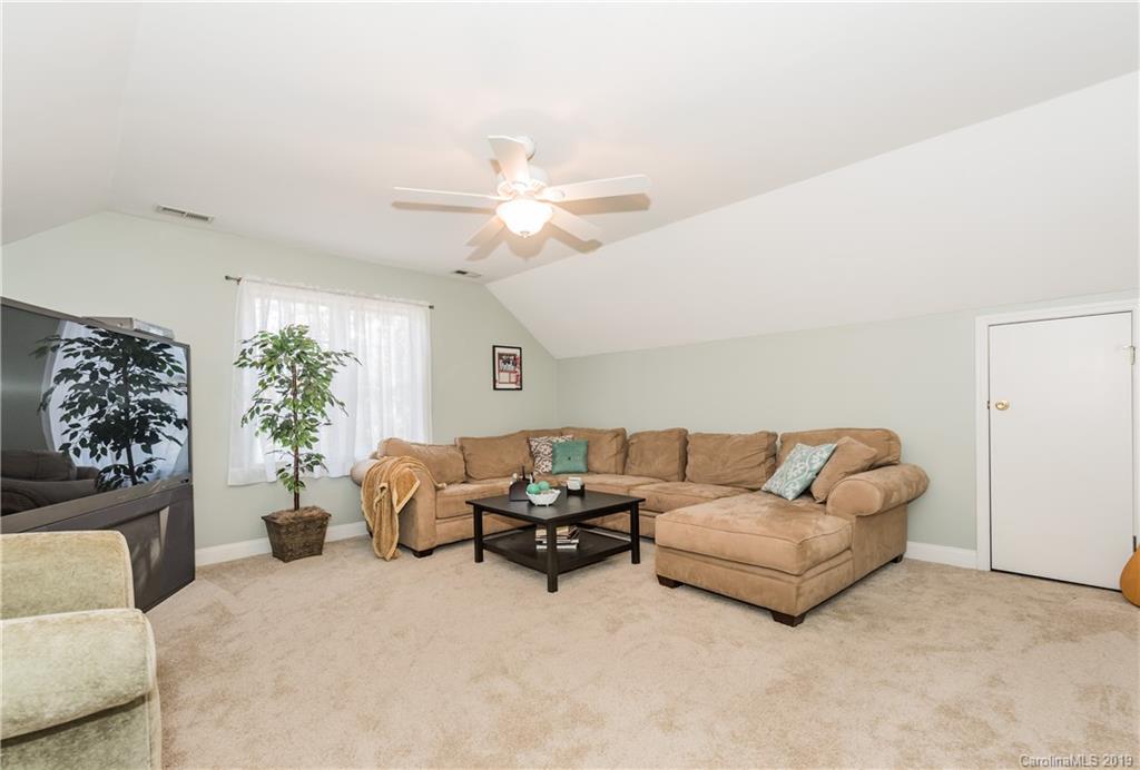 11161 Watertrace Drive Tega Cay, SC 29708 - Photo 18 of 24 a living room with furniture flowerpot and a window