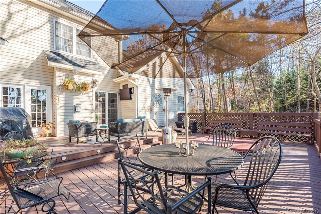 11161 Watertrace Drive Tega Cay, SC 29708 - Photo 22 of 24 a view of a patio with table and chairs and potted plants