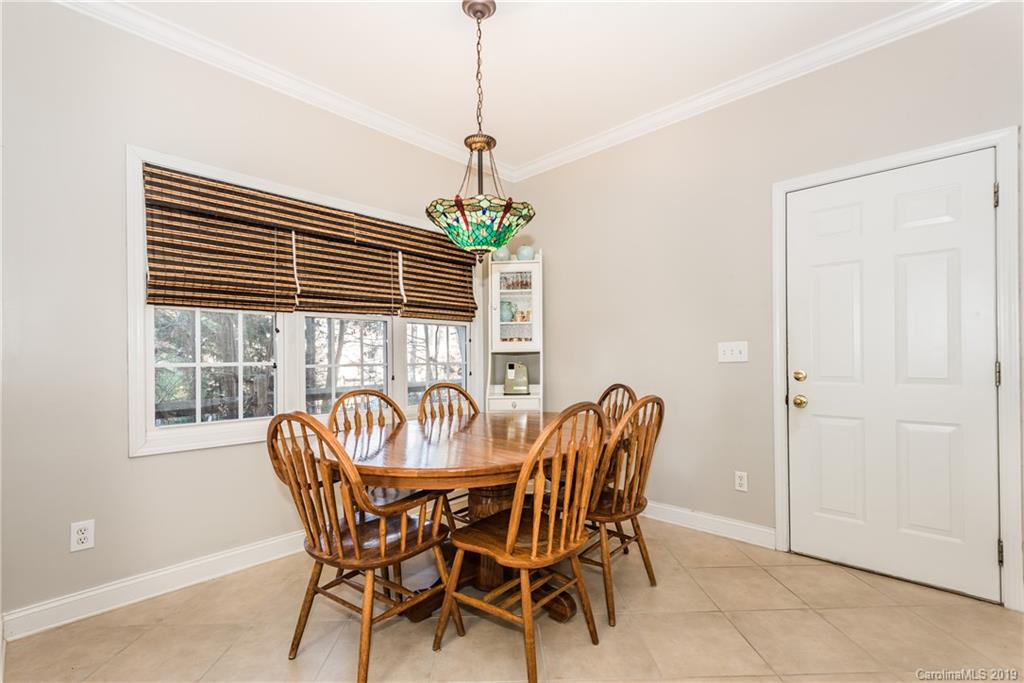 11161 Watertrace Drive Tega Cay, SC 29708 - Photo 8 of 24 a view of a dining room with furniture window and outside view