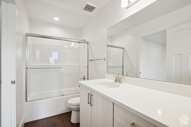 1615 North Angel Street, Unit F Layton, UT 84041 - Photo 16 of 45 Full bath featuring bath / shower combo with glass door, vanity, dark wood-type flooring, and recessed lighting