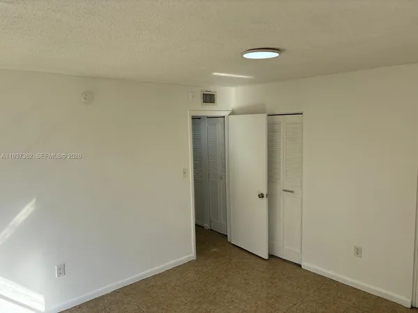 a view of hallway with white walls