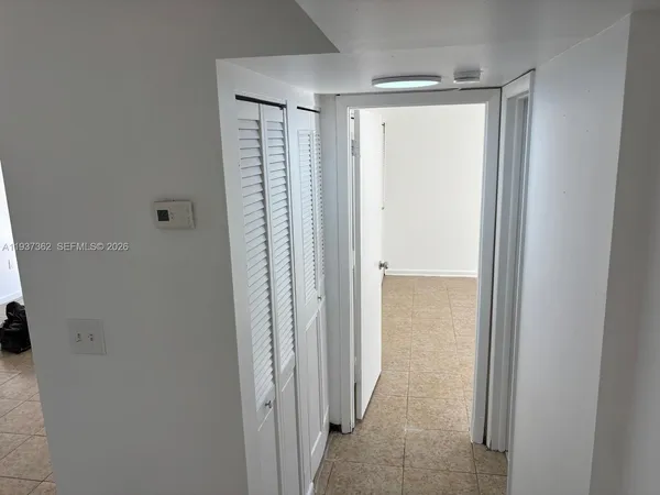 a view of a small space with wooden floor