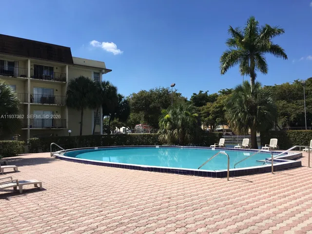 a view of outdoor space with swimming pool and patio