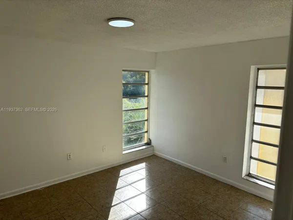 an empty room with windows