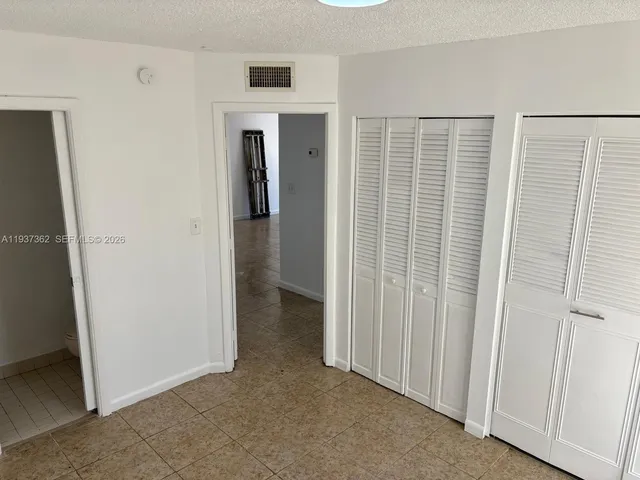 a view of livingroom with hardwood floor and cabinet