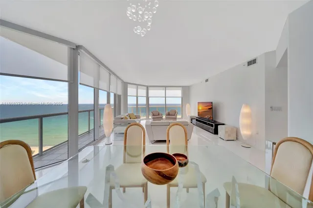 a view of a dining room with furniture window and outside view