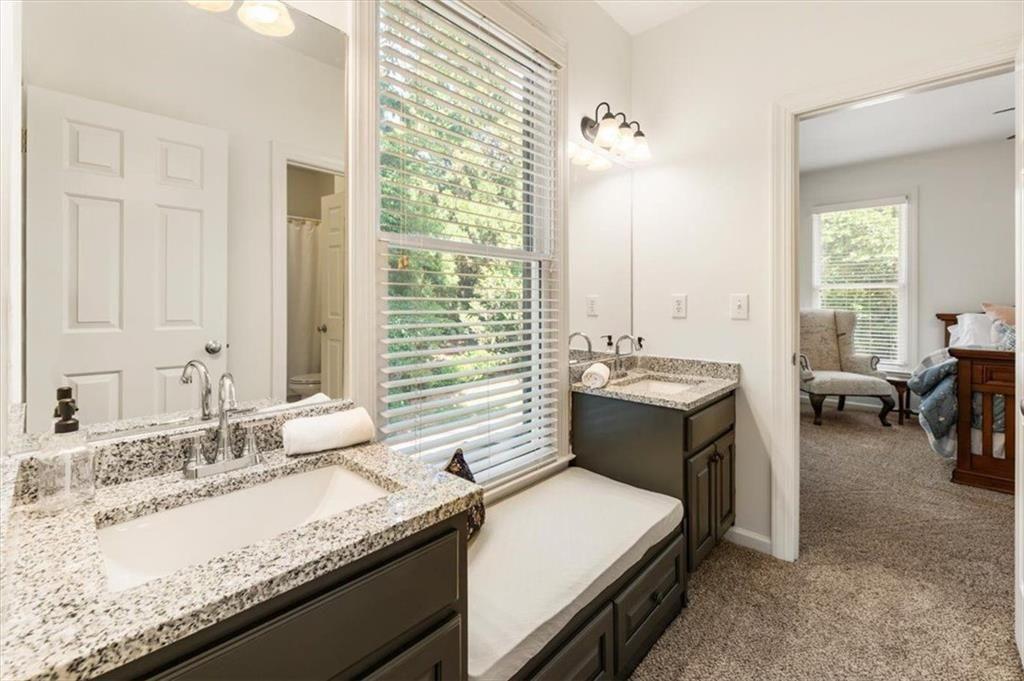 3910 Two Rivers Drive Cumming, GA 30041 - Photo 55 of 110 a en suite bathroom with a granite countertop sink and a bathtub