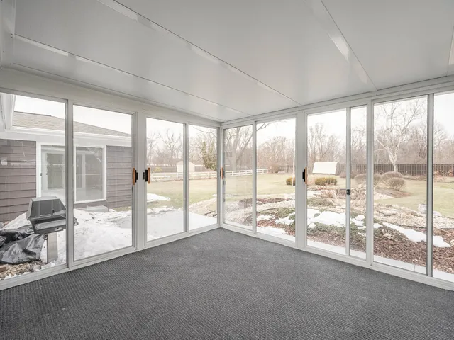 a view of an empty room and windows