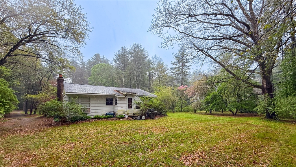 116 Lincoln Road Wayland, MA 01778 - Photo 20 of 26 a front view of house with yard and green space