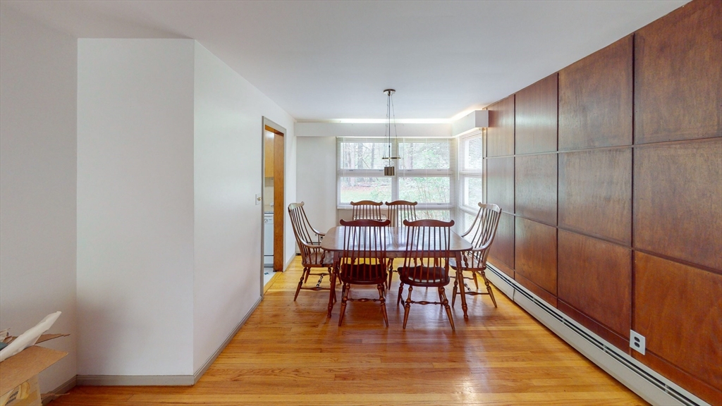 116 Lincoln Road Wayland, MA 01778 - Photo 7 of 26 a view of a dining room with furniture window and wooden floor