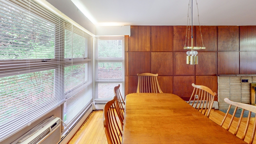 116 Lincoln Road Wayland, MA 01778 - Photo 9 of 26 a bedroom with a bed and a large window with balcony view