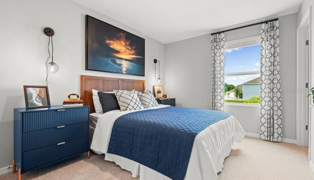 2924 Skyline Loop Kissimmee, FL 34758 - Photo 10 of 22 a bedroom with bed dresser and window