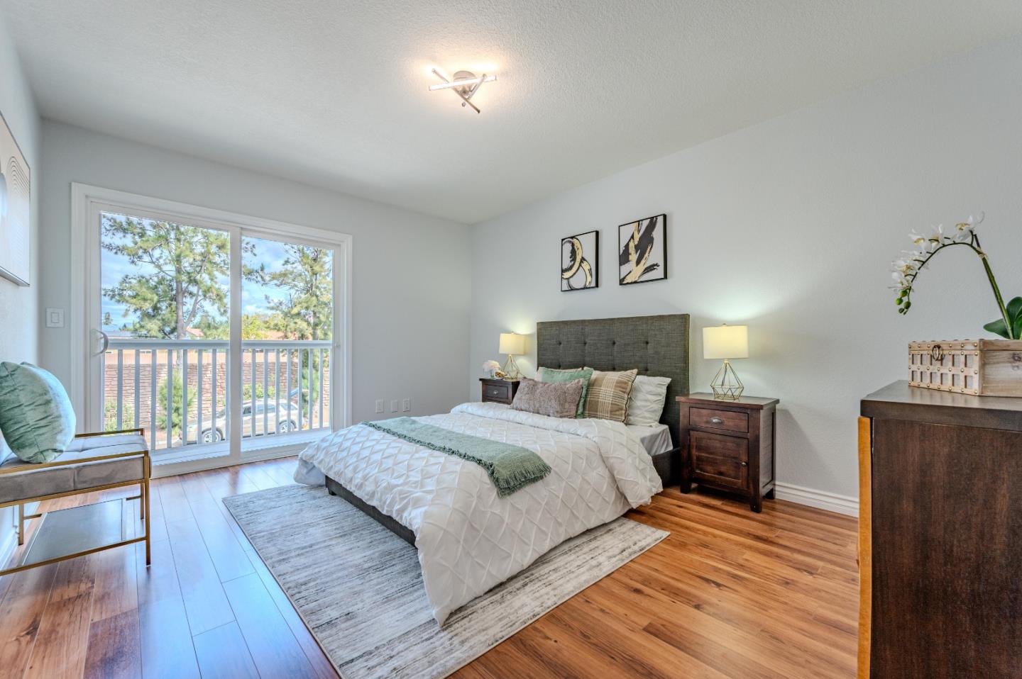 99 Jacklin Court Milpitas, CA 95035 - Photo 18 of 25 a spacious bedroom with a bed and wooden floor