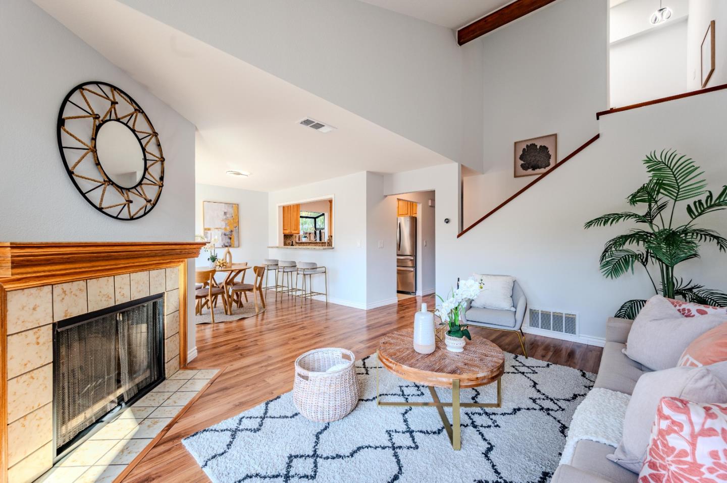 99 Jacklin Court Milpitas, CA 95035 - Photo 6 of 25 a living room with furniture a fireplace and a potted plant
