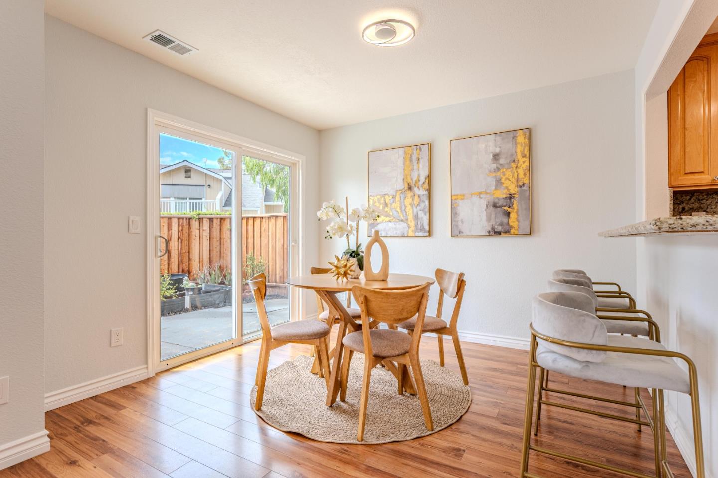 99 Jacklin Court Milpitas, CA 95035 - Photo 7 of 25 a view of a dining room with furniture and wooden floor