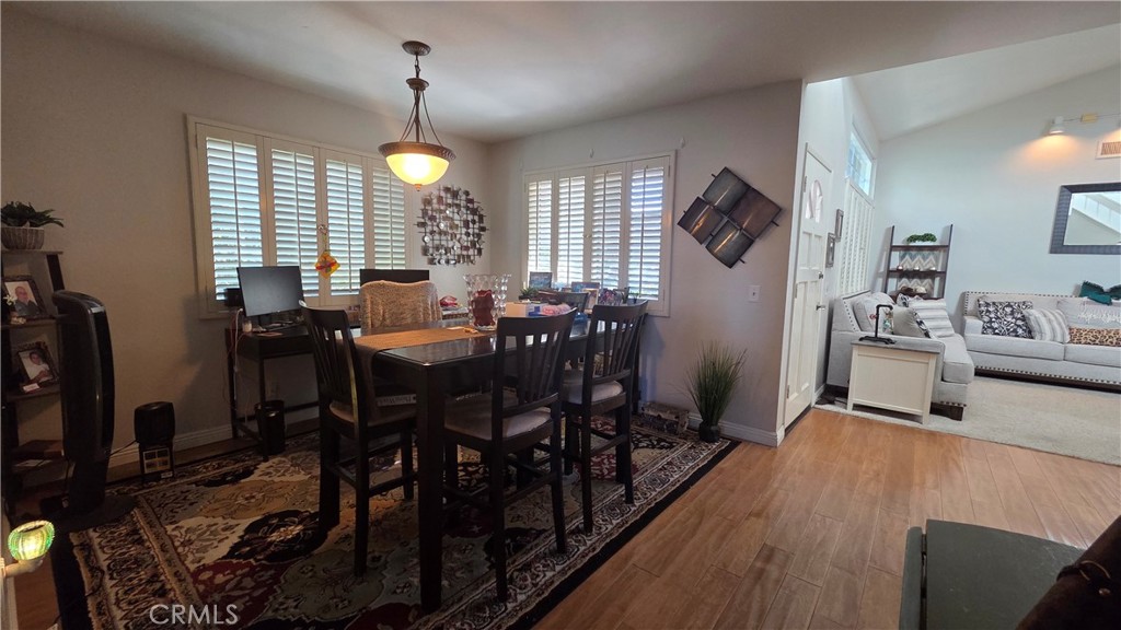4 Leesburg Irvine, CA 92620 - Photo 11 of 18 a view of a dining room with furniture window and wooden floor