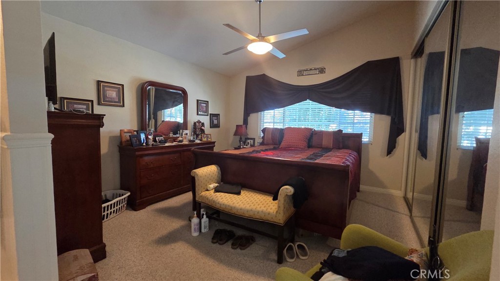 4 Leesburg Irvine, CA 92620 - Photo 13 of 18 a bedroom with a bed and a chandelier