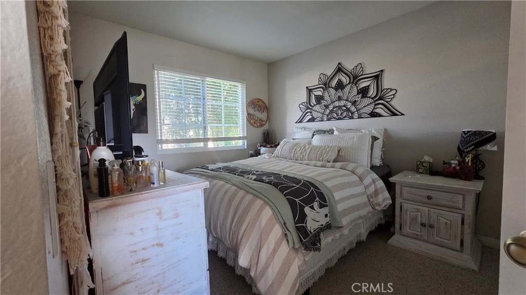 4 Leesburg Irvine, CA 92620 - Photo 16 of 18 a bed sitting in a bedroom next to a window