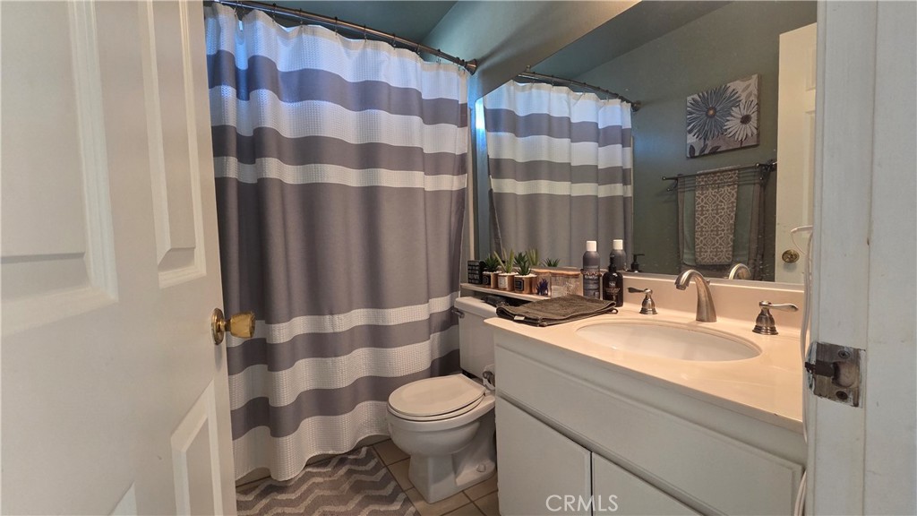 4 Leesburg Irvine, CA 92620 - Photo 17 of 18 a bathroom with a sink toilet and shower