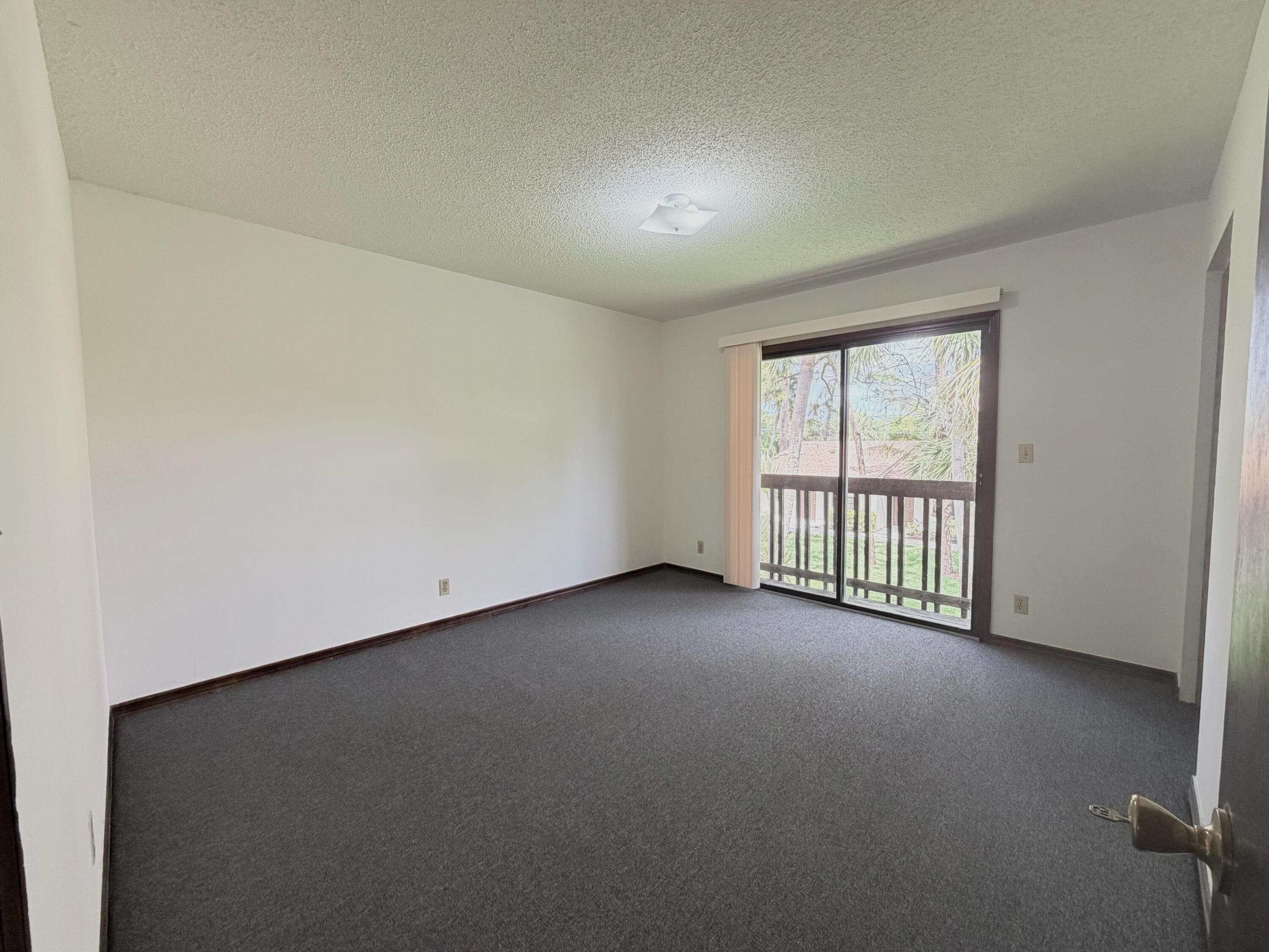 1226 Haverhill Road, Unit 3 Haverhill, FL 33417 - Photo 11 of 18 an empty room with windows