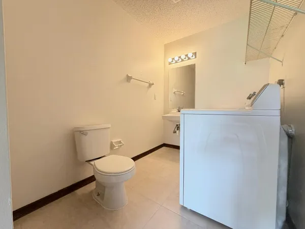 a bathroom with a toilet and a sink