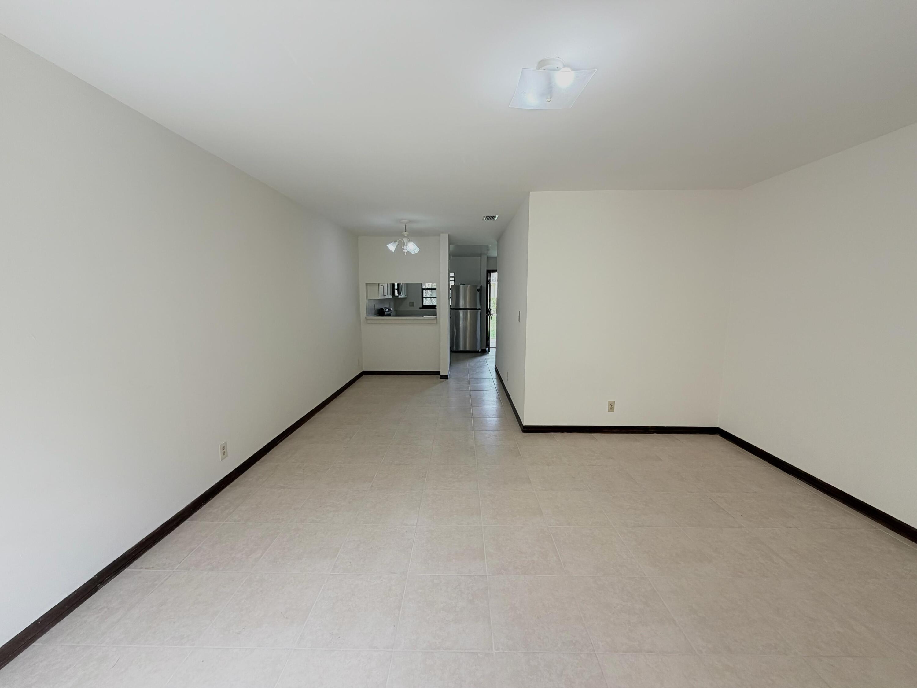 1226 Haverhill Road, Unit 3 Haverhill, FL 33417 - Photo 3 of 18 a view of a room with natural light