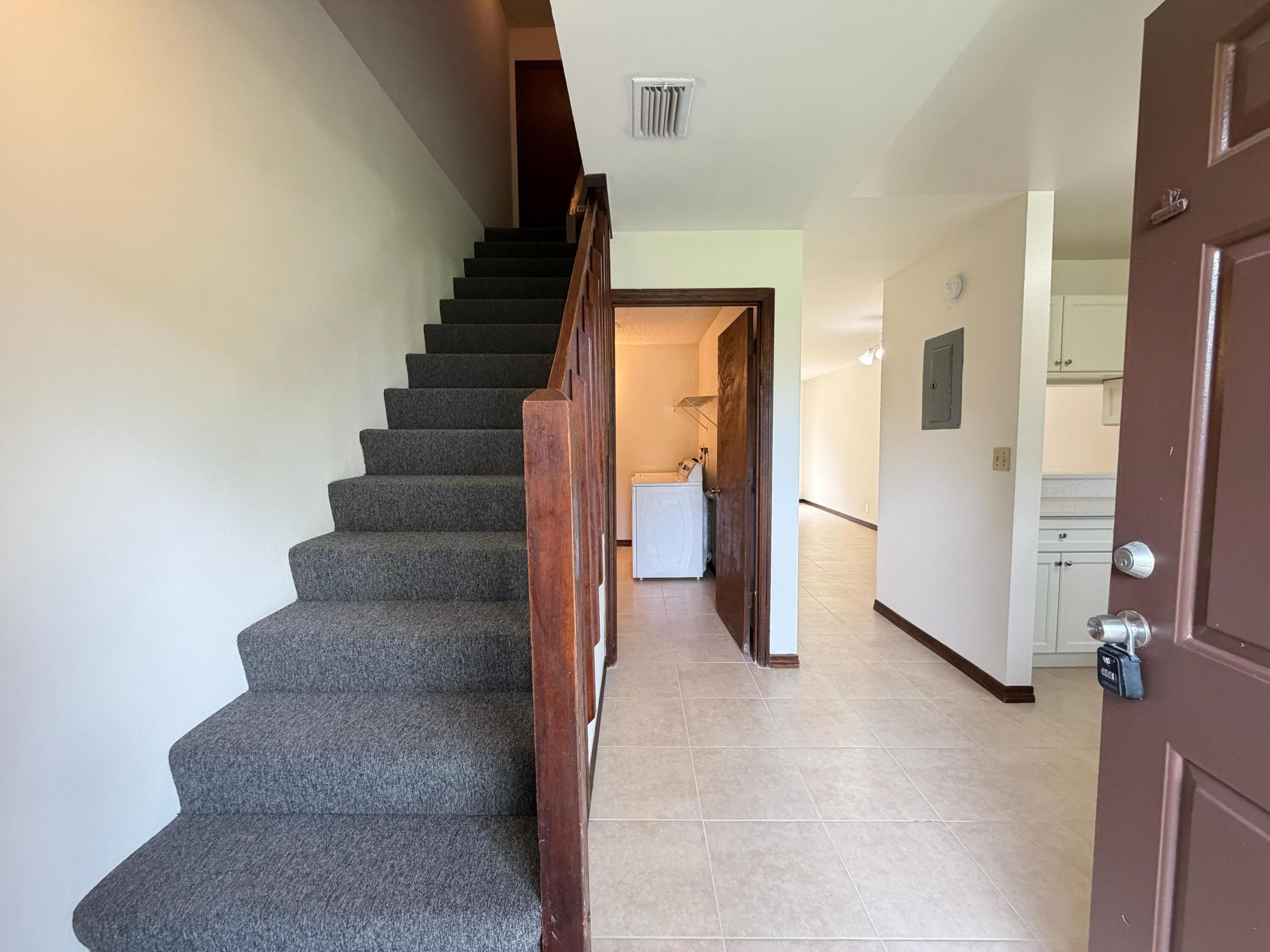 1226 Haverhill Road, Unit 3 Haverhill, FL 33417 - Photo 5 of 18 a view of entryway and hall with a hallway