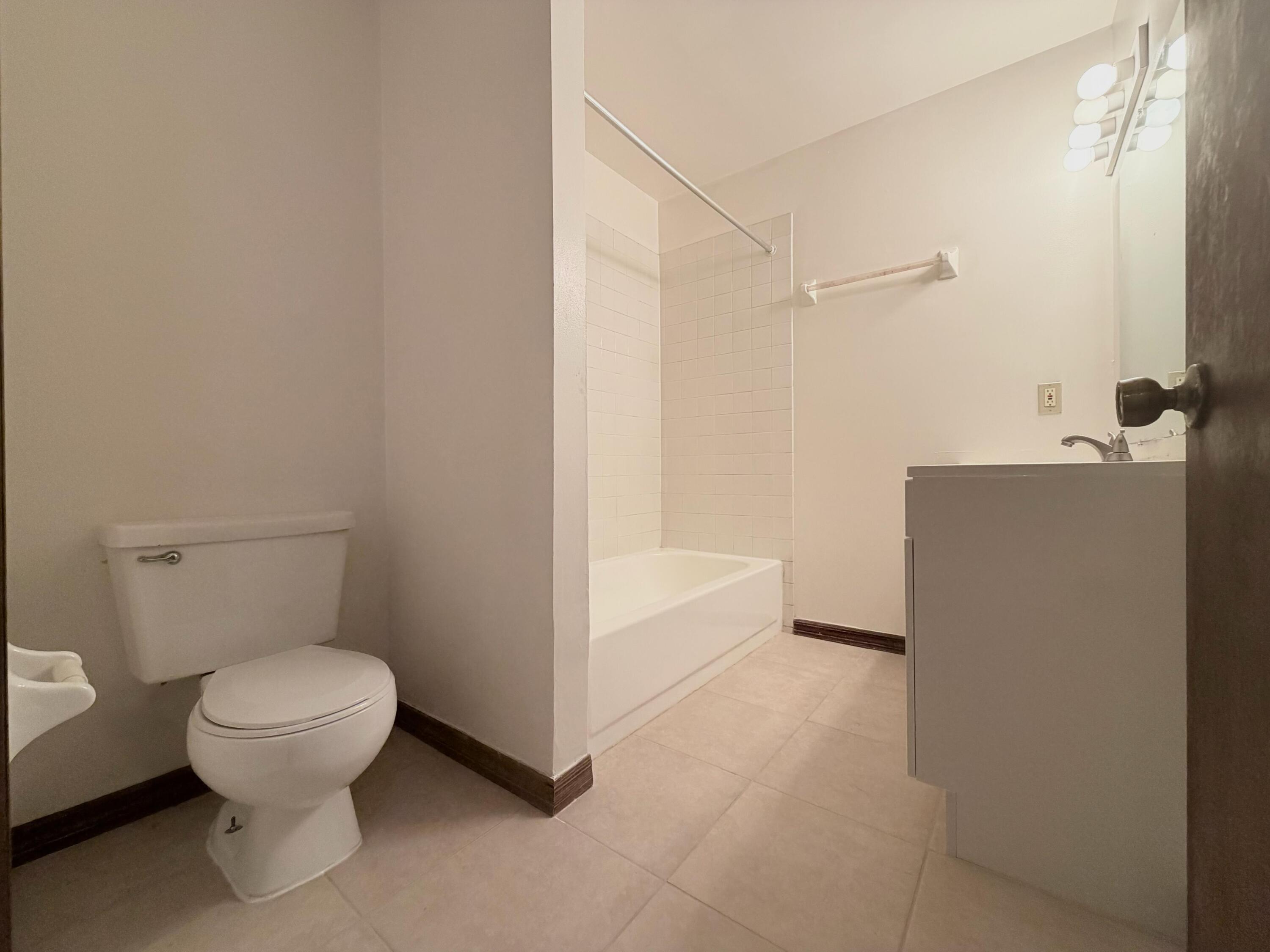1226 Haverhill Road, Unit 3 Haverhill, FL 33417 - Photo 6 of 18 a bathroom with a toilet and a shower