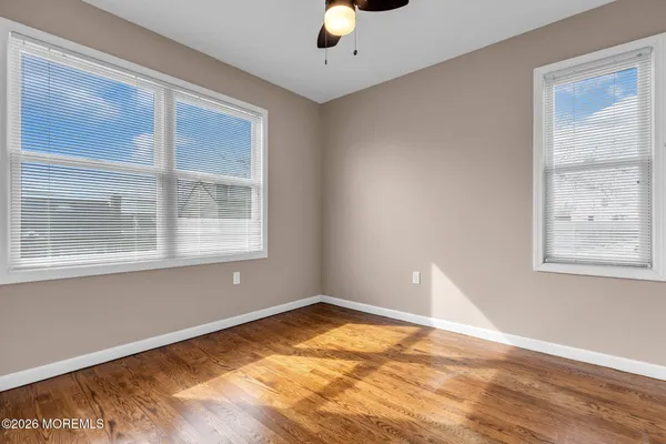 a view of empty room with windows