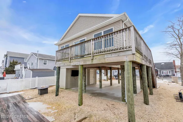 a view of a house with a snow in the background