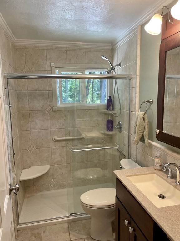 305 Potter Road Framingham, MA 01701 - Photo 13 of 21 a bathroom with a sink toilet and shower