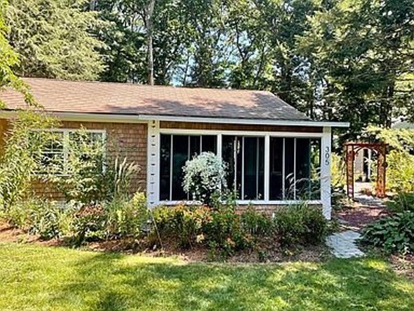 305 Potter Road Framingham, MA 01701 - Photo 2 of 21 a front view of a house with garden