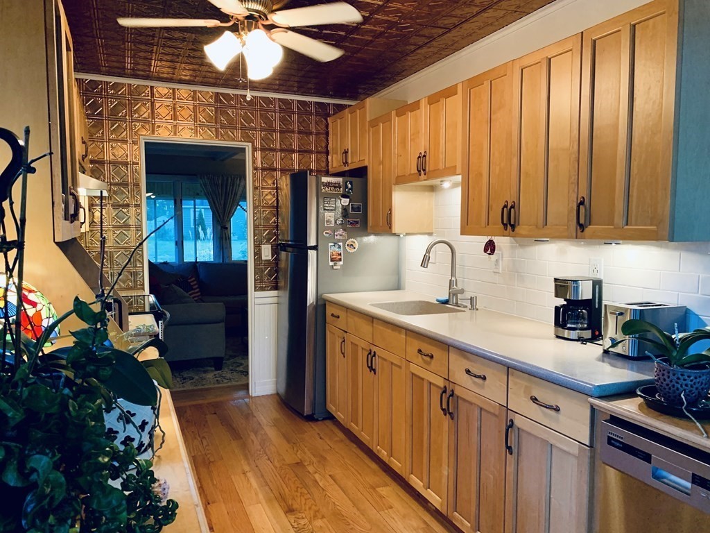 305 Potter Road Framingham, MA 01701 - Photo 8 of 21 a kitchen that has a sink and cabinets