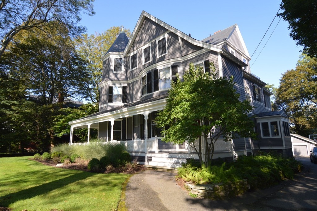 67 Temple Street Newton, MA 02465 - Photo 2 of 12 a front view of a house with a yard