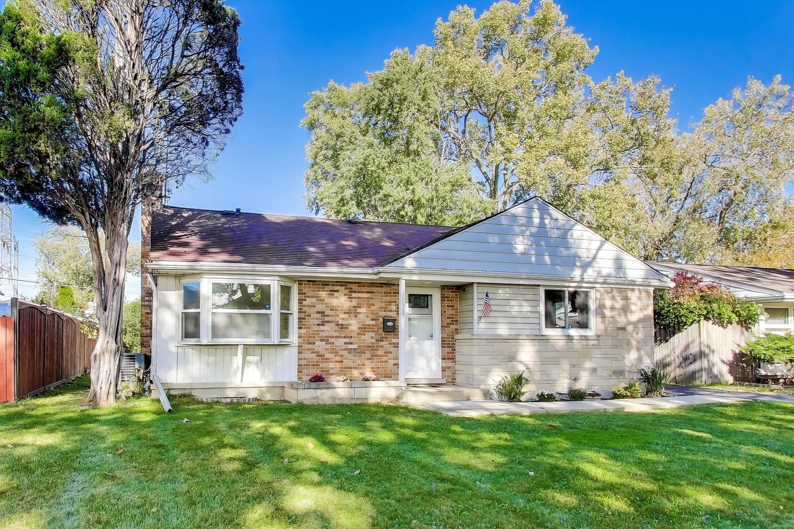 7332 Davis Street Morton Grove, IL 60053 - Photo 1 of 30 a front view of a house with a yard and garden