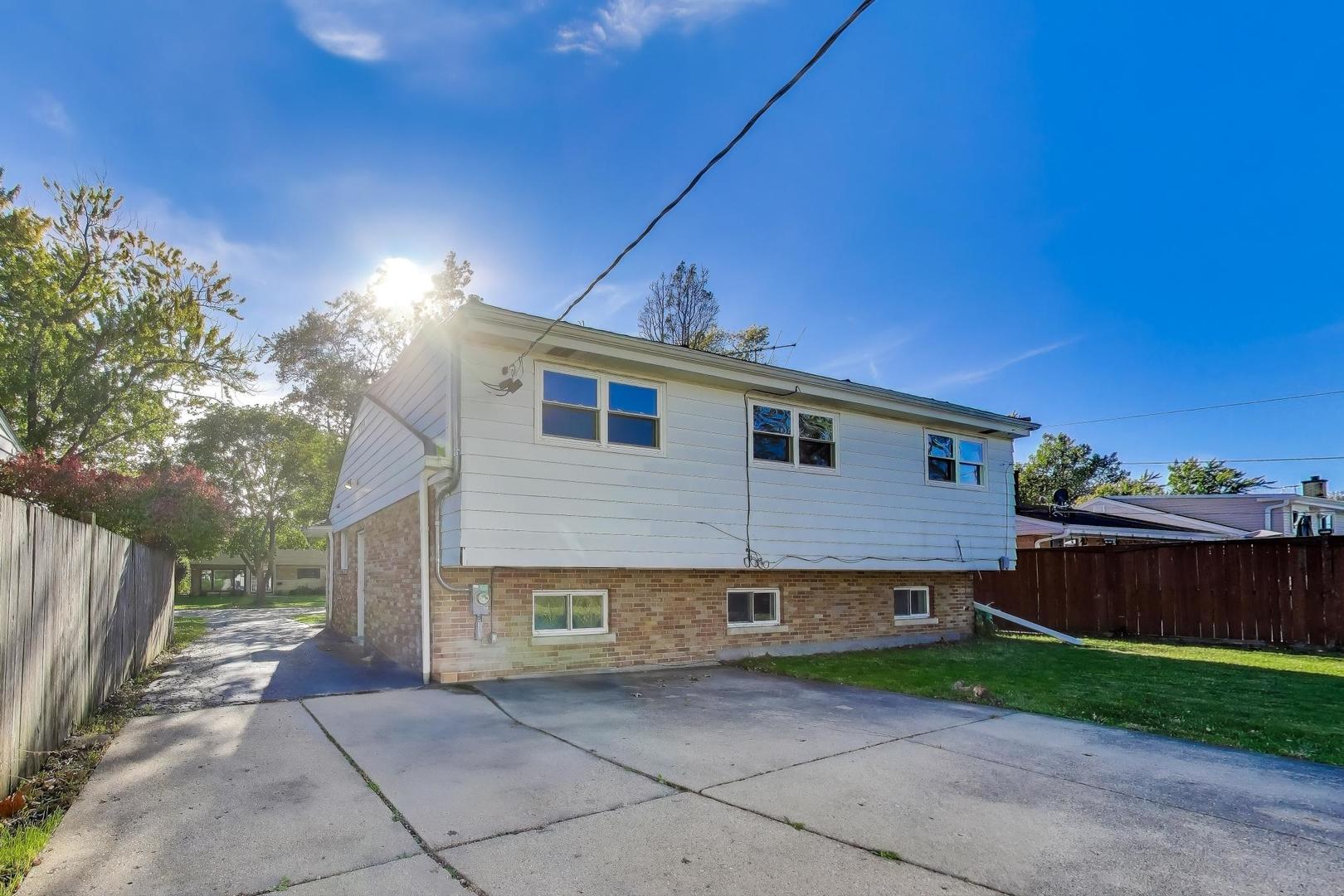 7332 Davis Street Morton Grove, IL 60053 - Photo 24 of 30 a view of a house with a yard