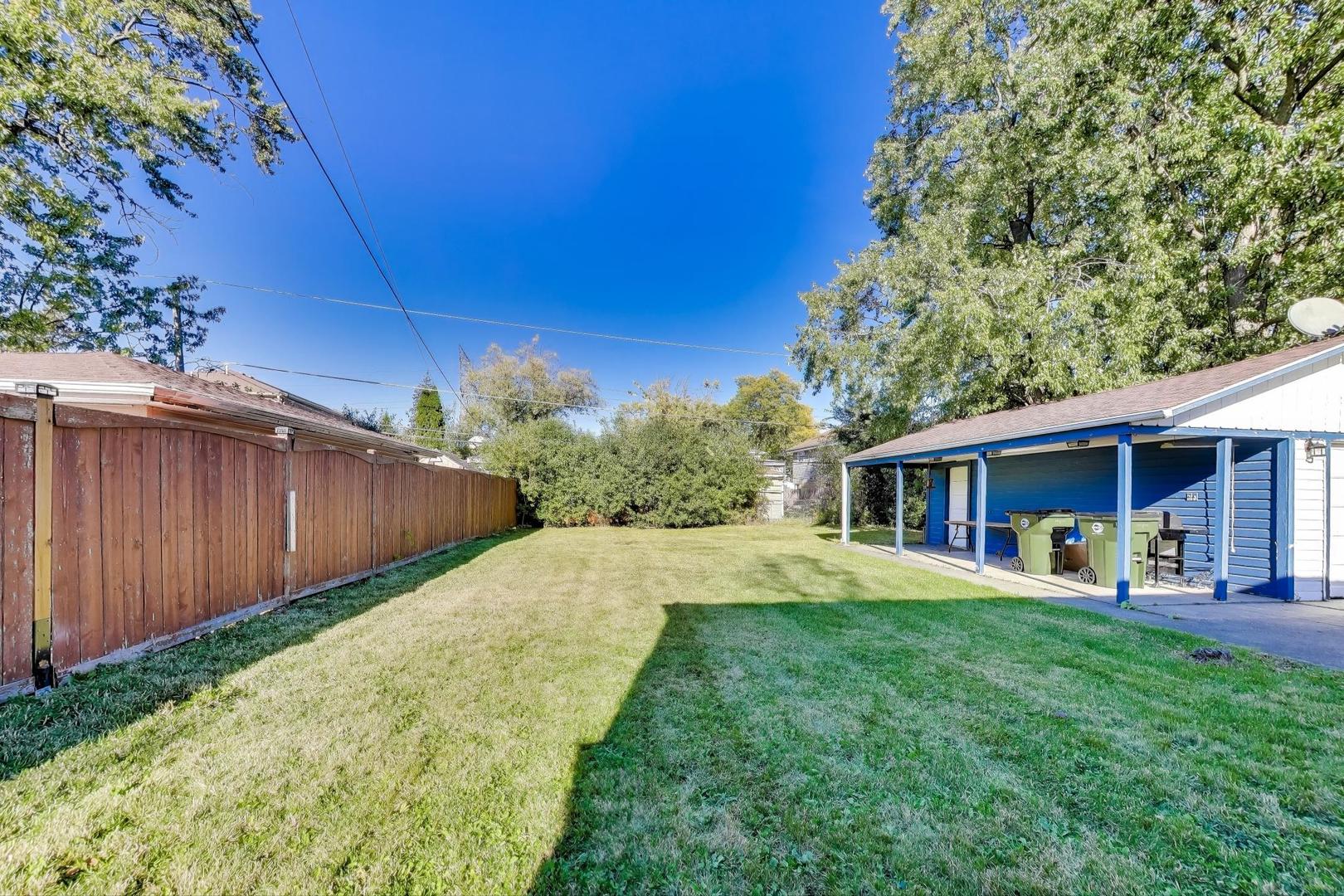 7332 Davis Street Morton Grove, IL 60053 - Photo 26 of 30 a front view of house with yard and green space