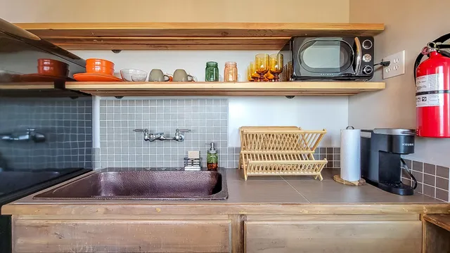 a view of a livingroom with furniture and windows